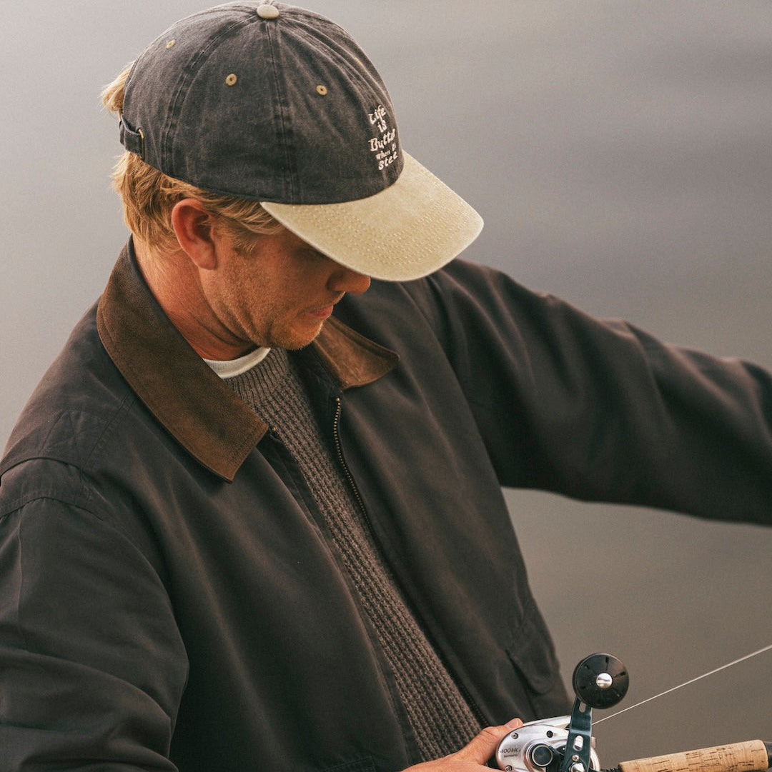 Man fishing with a rod on a cloudy day